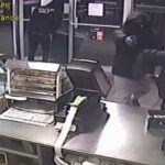 Suspects robbing store.