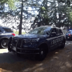 Seattle police vehicles at the scene.