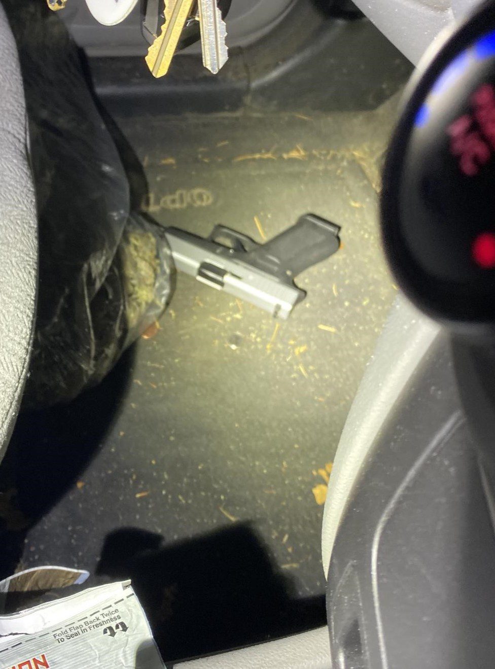 Gun located inside of stolen vehicle.