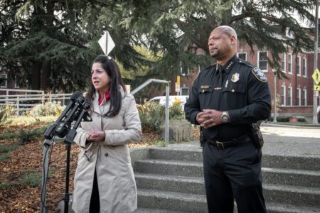 District 4 Councilmember Maritza Rivera speaking while Chief Barnes stands behind her.